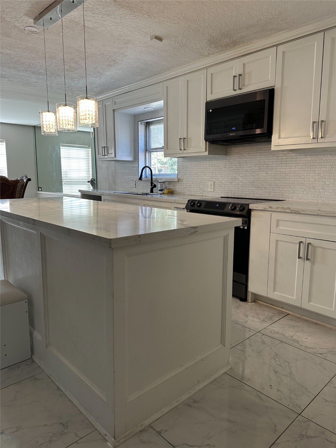 1011 Whitestone Lane Houston, TX 77073 - Photo 6 of 32 a kitchen with stainless steel appliances granite countertop a sink a stove and a microwave