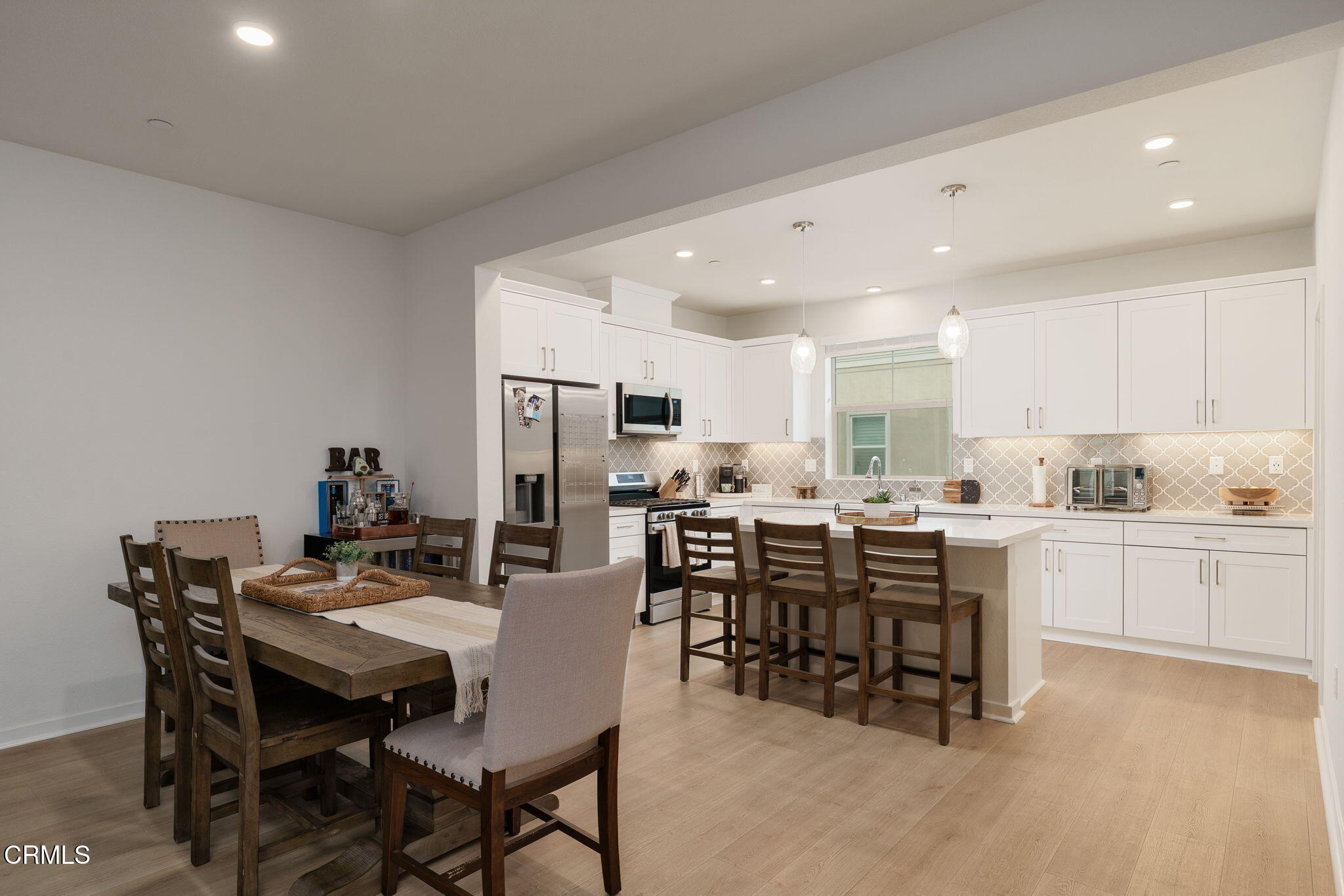 751 Winchester Drive Oxnard, CA 93036 - Photo 11 of 33 a view of a dining room with furniture and chandelier