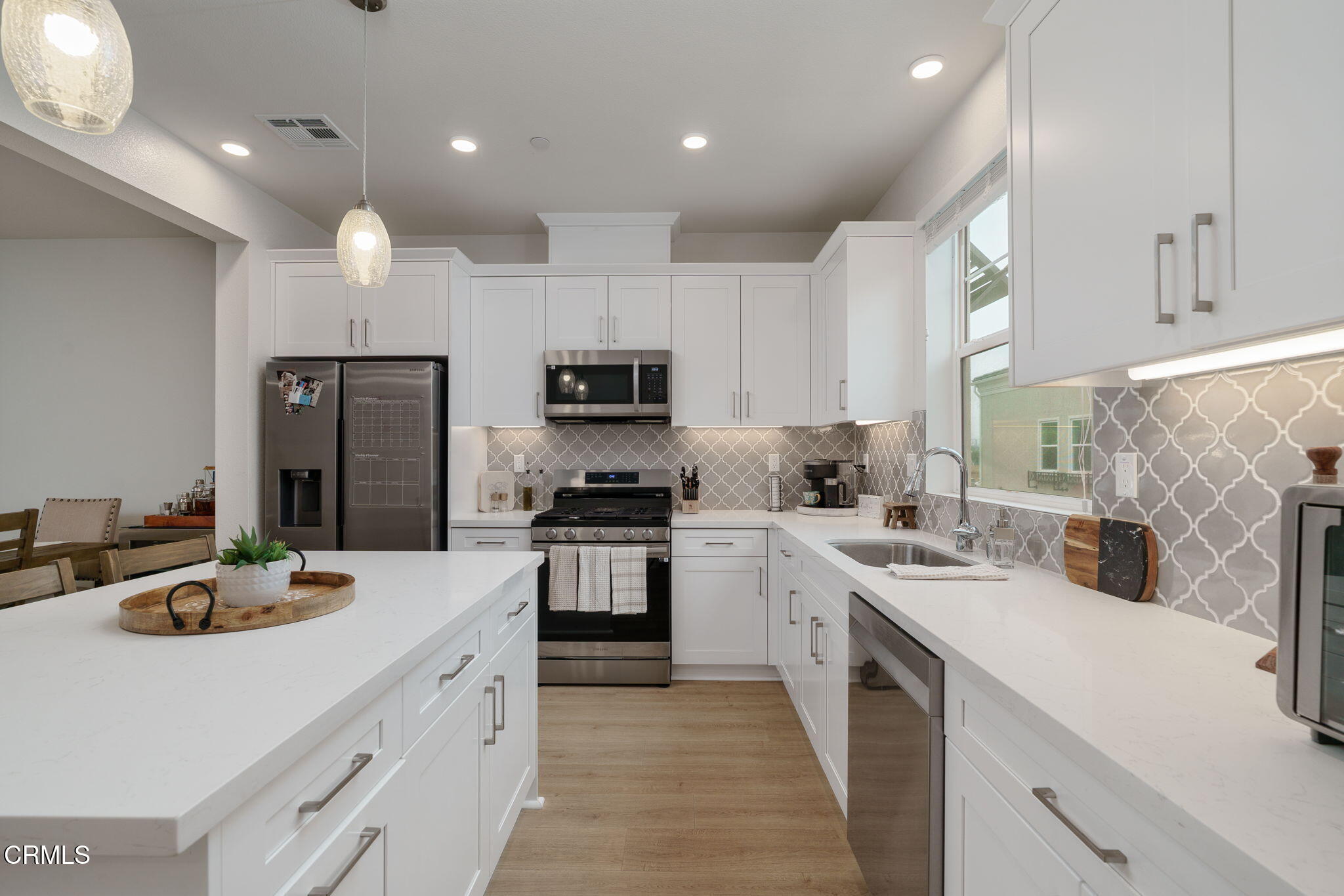751 Winchester Drive Oxnard, CA 93036 - Photo 14 of 33 a kitchen with a sink a stove and cabinets