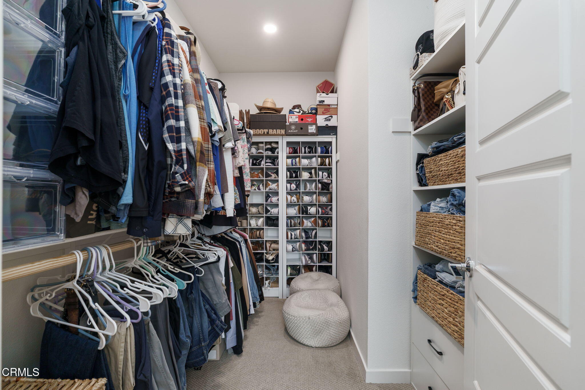 751 Winchester Drive Oxnard, CA 93036 - Photo 20 of 33 a view of walk in closet with clothes and shoes