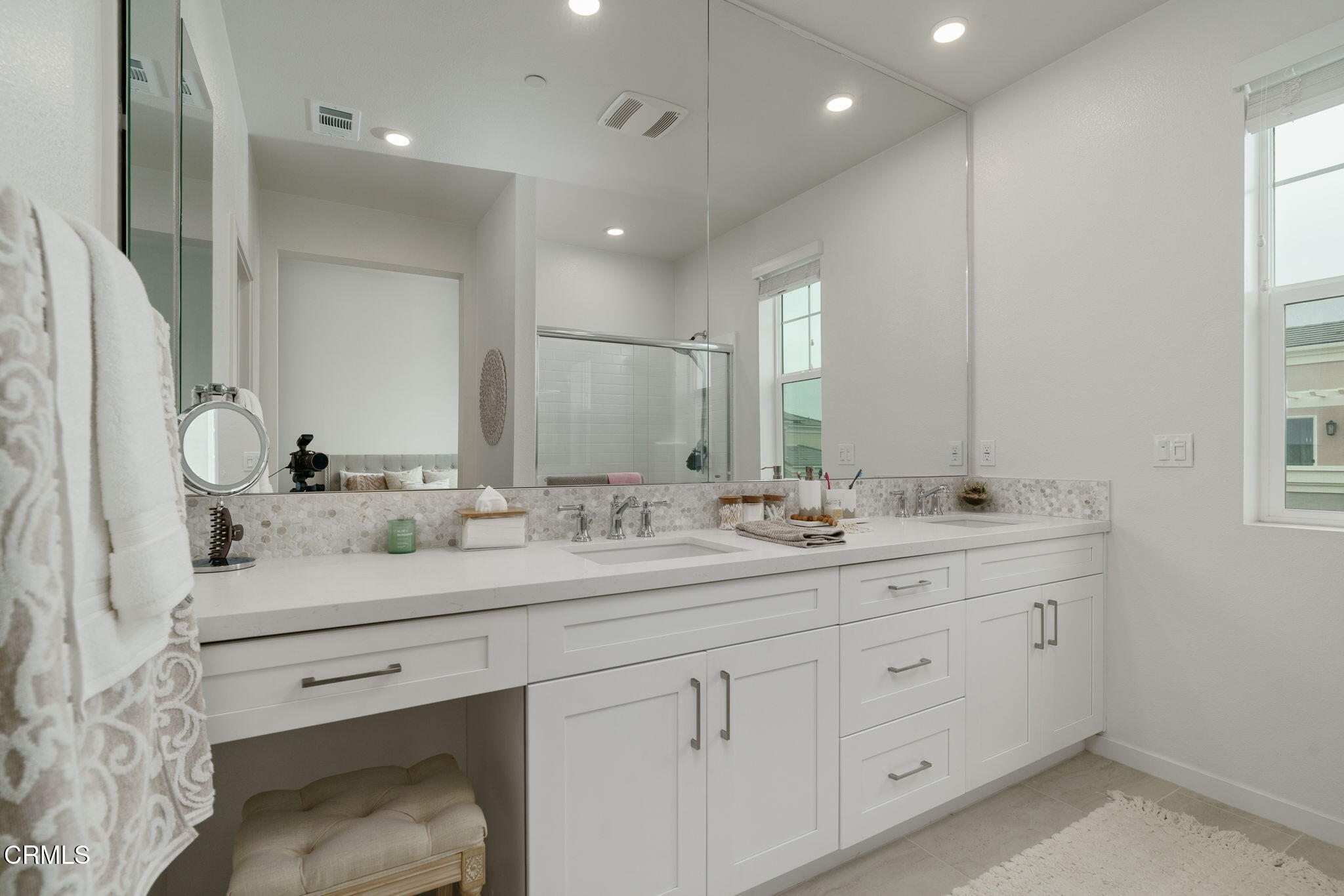 751 Winchester Drive Oxnard, CA 93036 - Photo 22 of 33 a bathroom with a double vanity sink and mirror