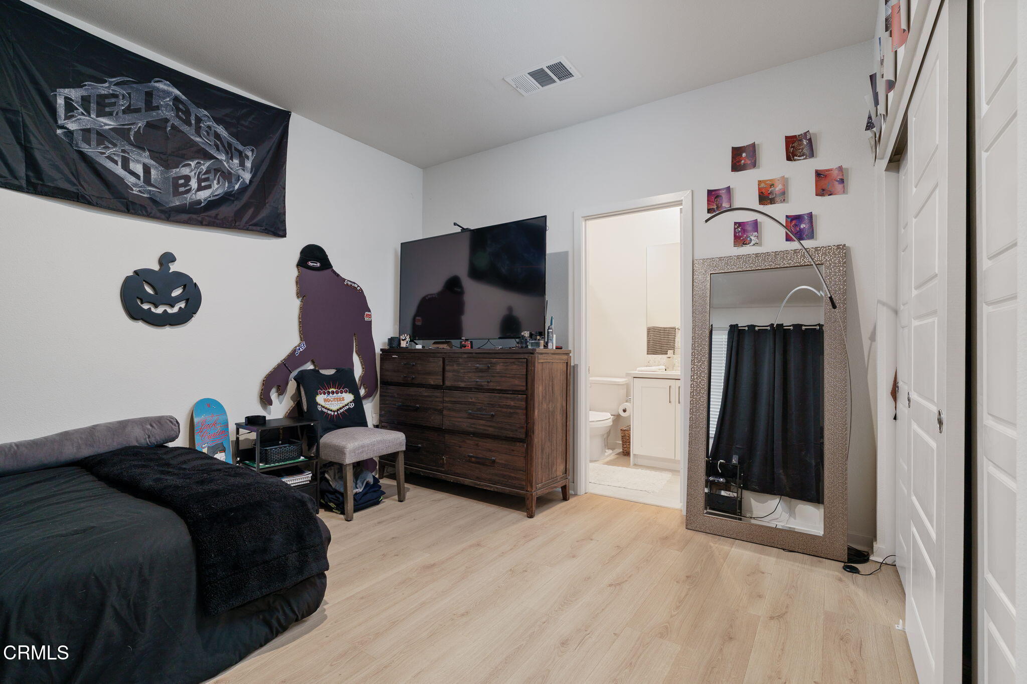 751 Winchester Drive Oxnard, CA 93036 - Photo 5 of 33 a bedroom with furniture and wooden floor
