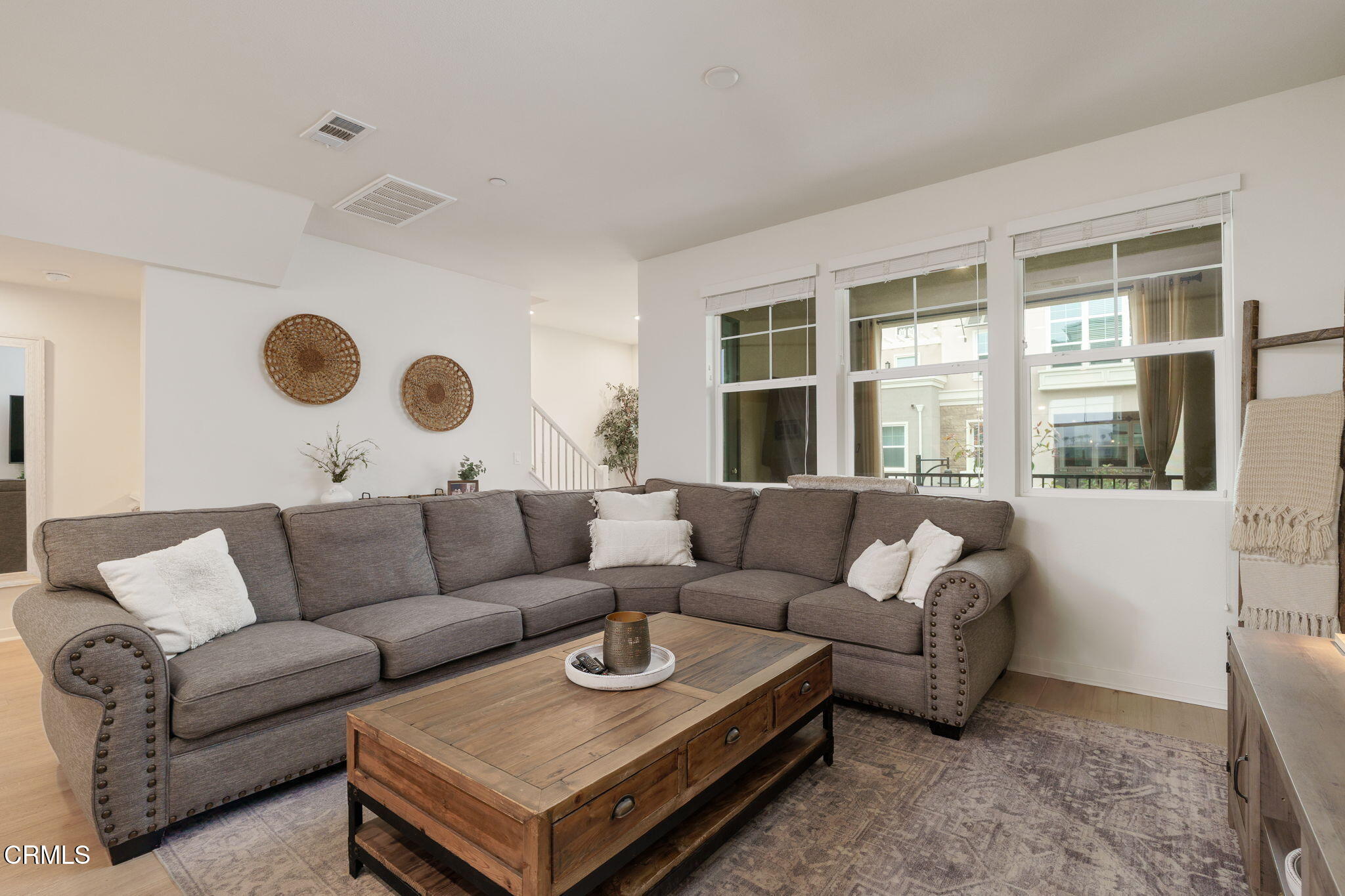 751 Winchester Drive Oxnard, CA 93036 - Photo 9 of 33 a living room with furniture and a large window