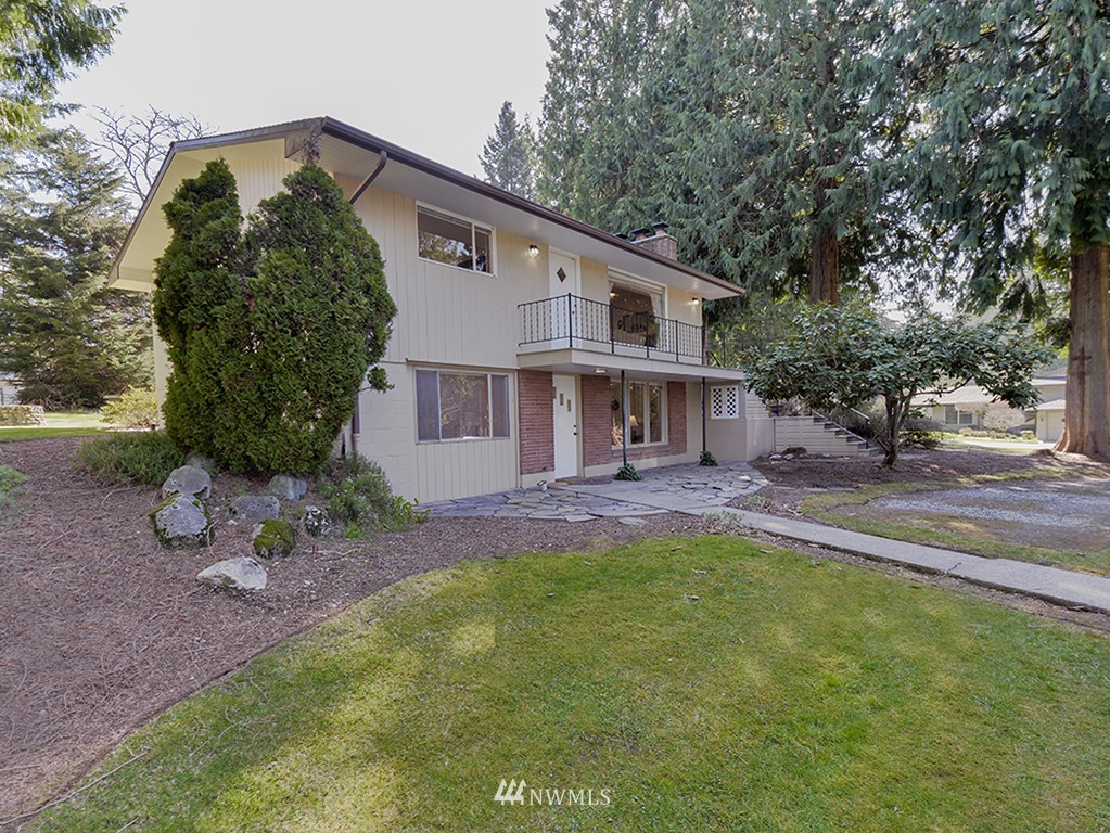 15256 Southeast 116th Street Renton, WA 98059 - Photo 1 of 38 a view of a house with a yard