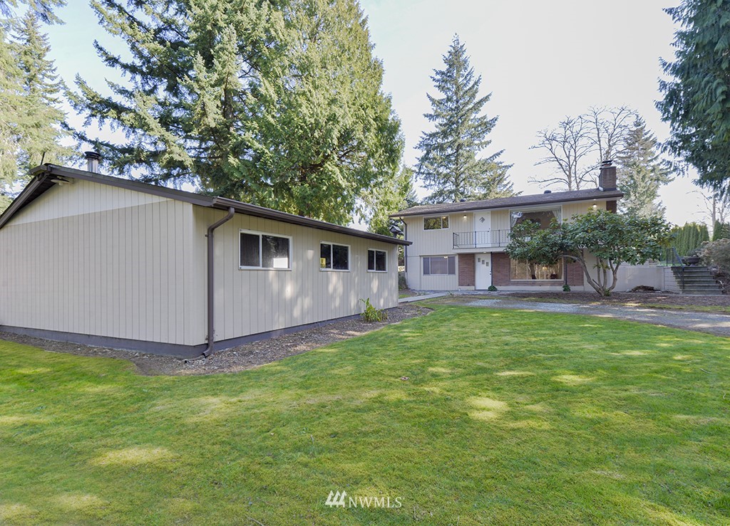 15256 Southeast 116th Street Renton, WA 98059 - Photo 2 of 38 a view of a house with a yard and sitting area