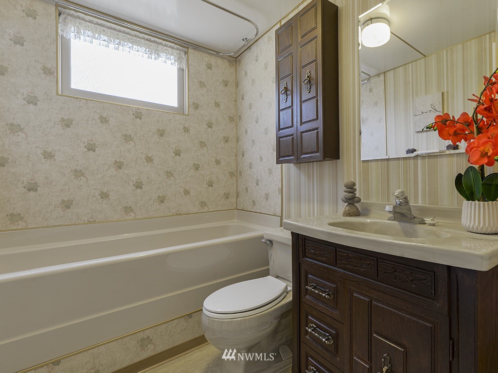 15256 Southeast 116th Street Renton, WA 98059 - Photo 13 of 38 a bathroom with a sink toilet and shower