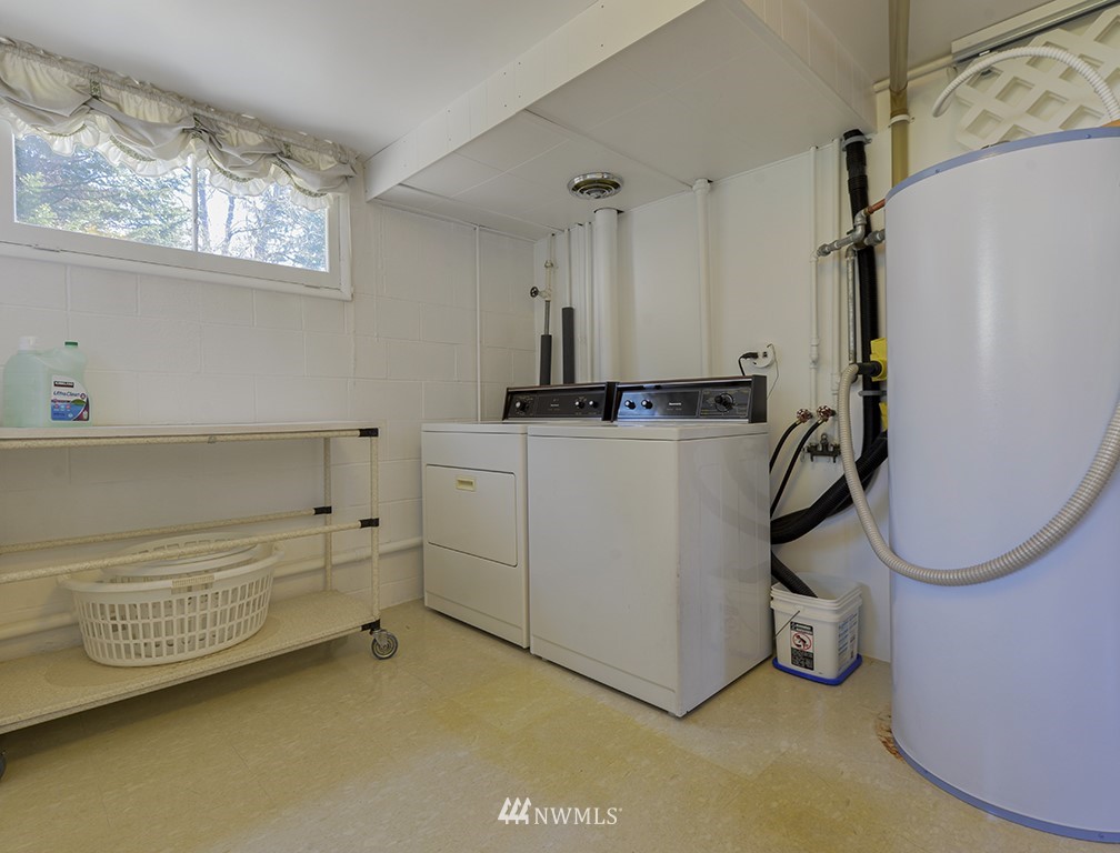 15256 Southeast 116th Street Renton, WA 98059 - Photo 15 of 38 a storage room with washer and dryer