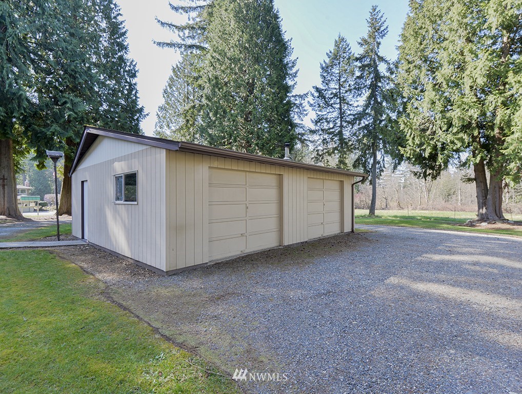 15256 Southeast 116th Street Renton, WA 98059 - Photo 3 of 38 a view of a house with a backyard