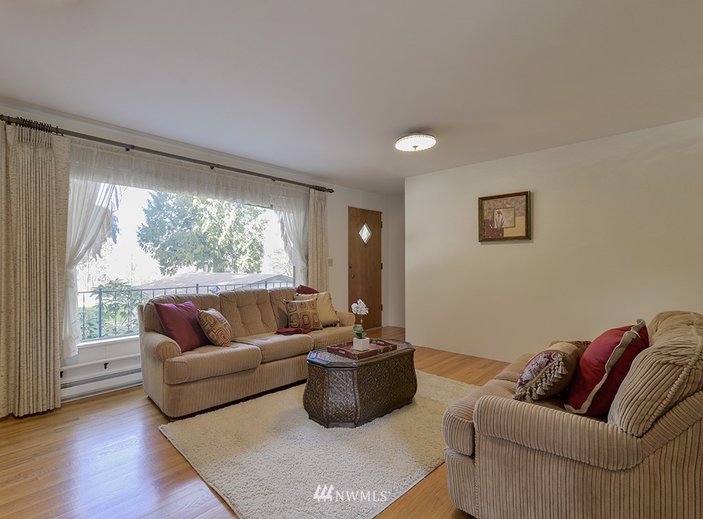 15256 Southeast 116th Street Renton, WA 98059 - Photo 23 of 38 a living room with furniture and a large window