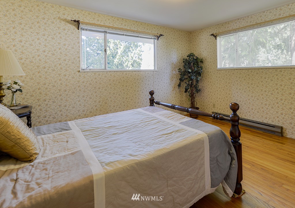 15256 Southeast 116th Street Renton, WA 98059 - Photo 29 of 38 a bedroom with a bed and a window