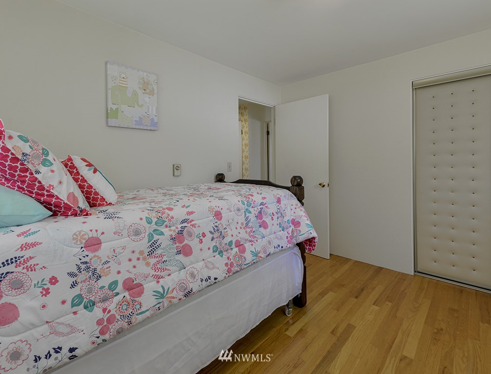 15256 Southeast 116th Street Renton, WA 98059 - Photo 31 of 38 a bedroom with a bed and window