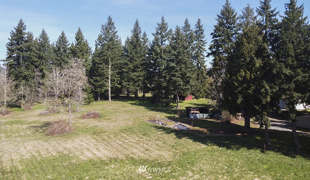 15256 Southeast 116th Street Renton, WA 98059 - Photo 32 of 38 a bench is sitting in the middle of a yard