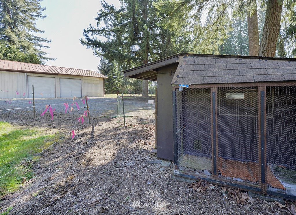 15256 Southeast 116th Street Renton, WA 98059 - Photo 37 of 38 a backyard of a house with table and chairs