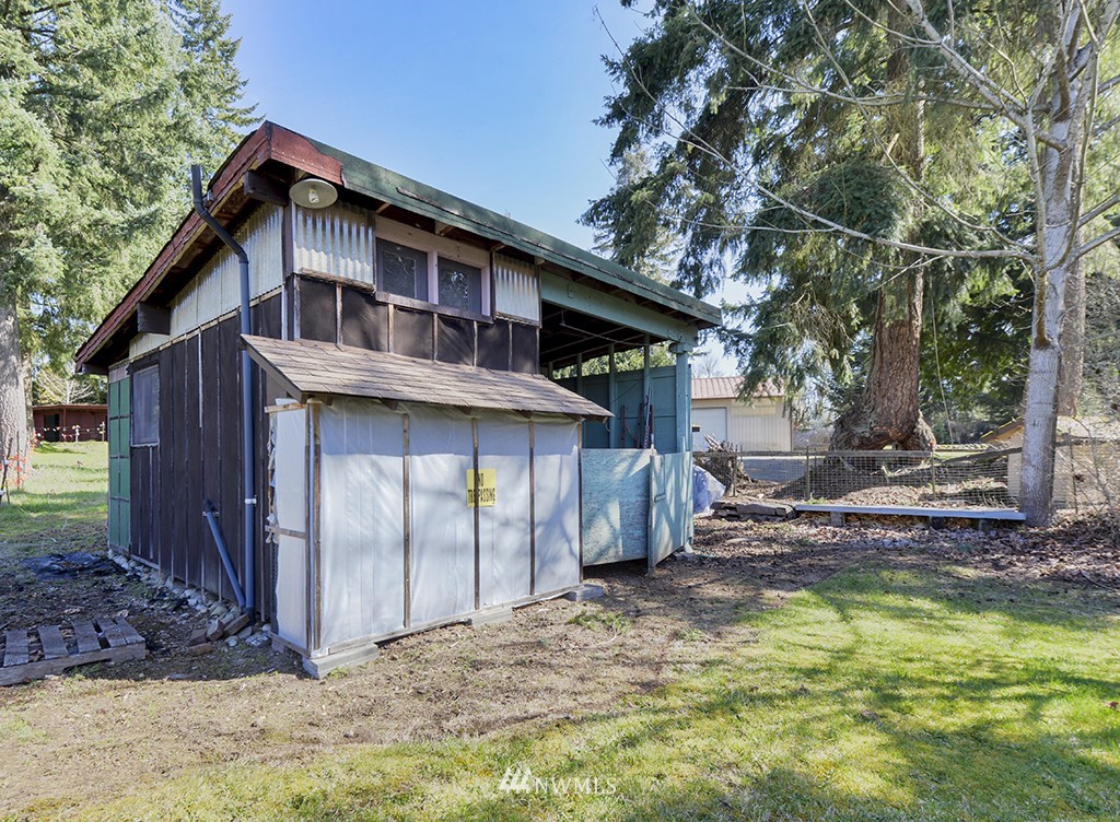 15256 Southeast 116th Street Renton, WA 98059 - Photo 38 of 38 a view of a house with a small yard plants and large tree