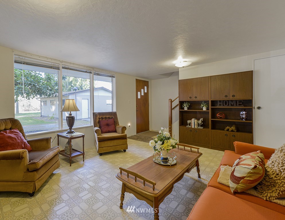 15256 Southeast 116th Street Renton, WA 98059 - Photo 7 of 38 a living room with furniture and wooden floor