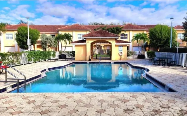 a view of a building with a swimming pool