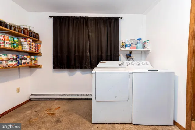 a utility room with washer and dryer