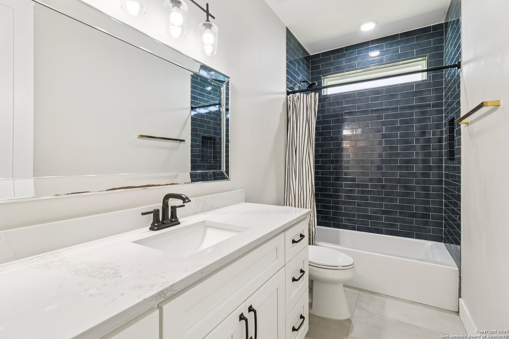 517 Preston Trail Boerne, TX 78006 - Photo 19 of 40 a bathroom with a sink toilet vanity and shower