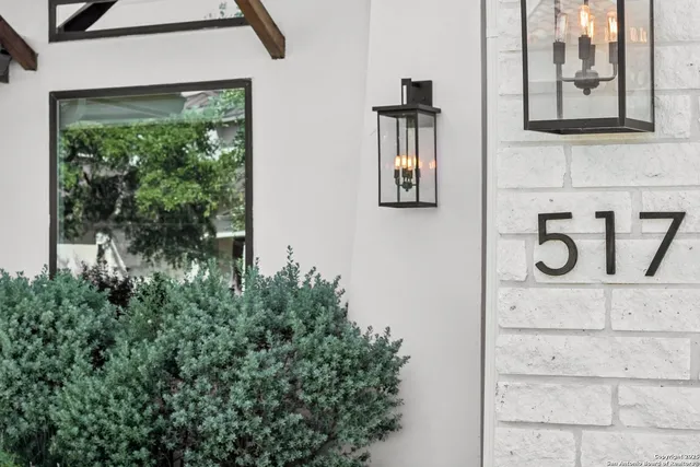 an aerial view of residential houses with outdoor space and street view