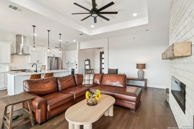 a living room with furniture and a fireplace