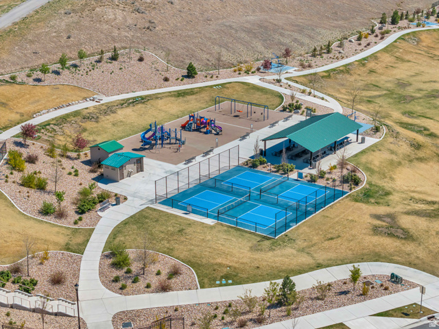 1577 Quailhill Road Saratoga Springs, UT 84045 - Photo 40 of 46 Drone / aerial view of a park with playground, pickleball courts and a pavilion