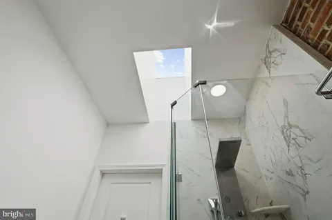 a bathroom with a bathtub and a sink