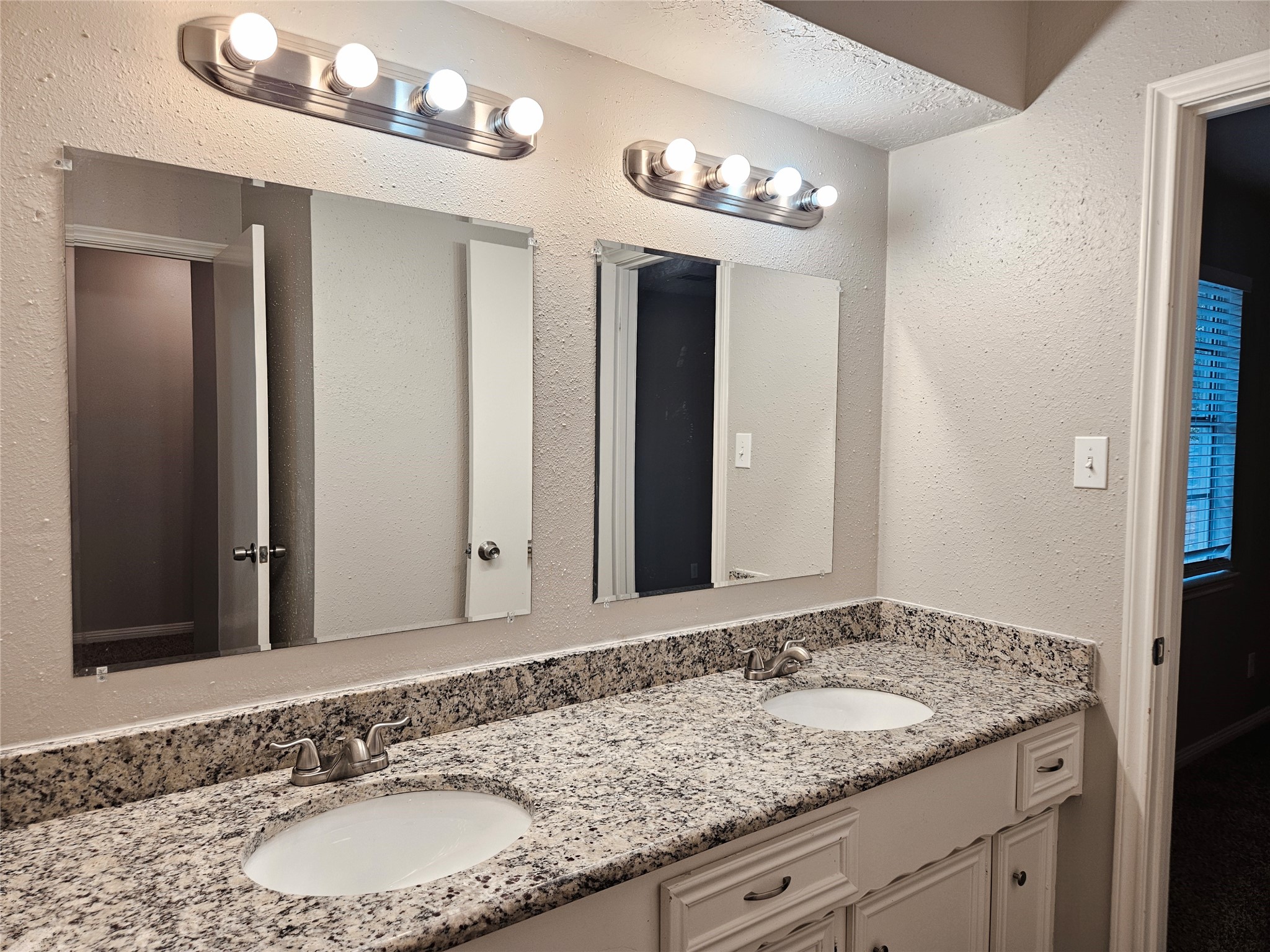 6126 Inway Drive Spring, TX 77389 - Photo 23 of 27 a bathroom with a granite countertop sink and a mirror