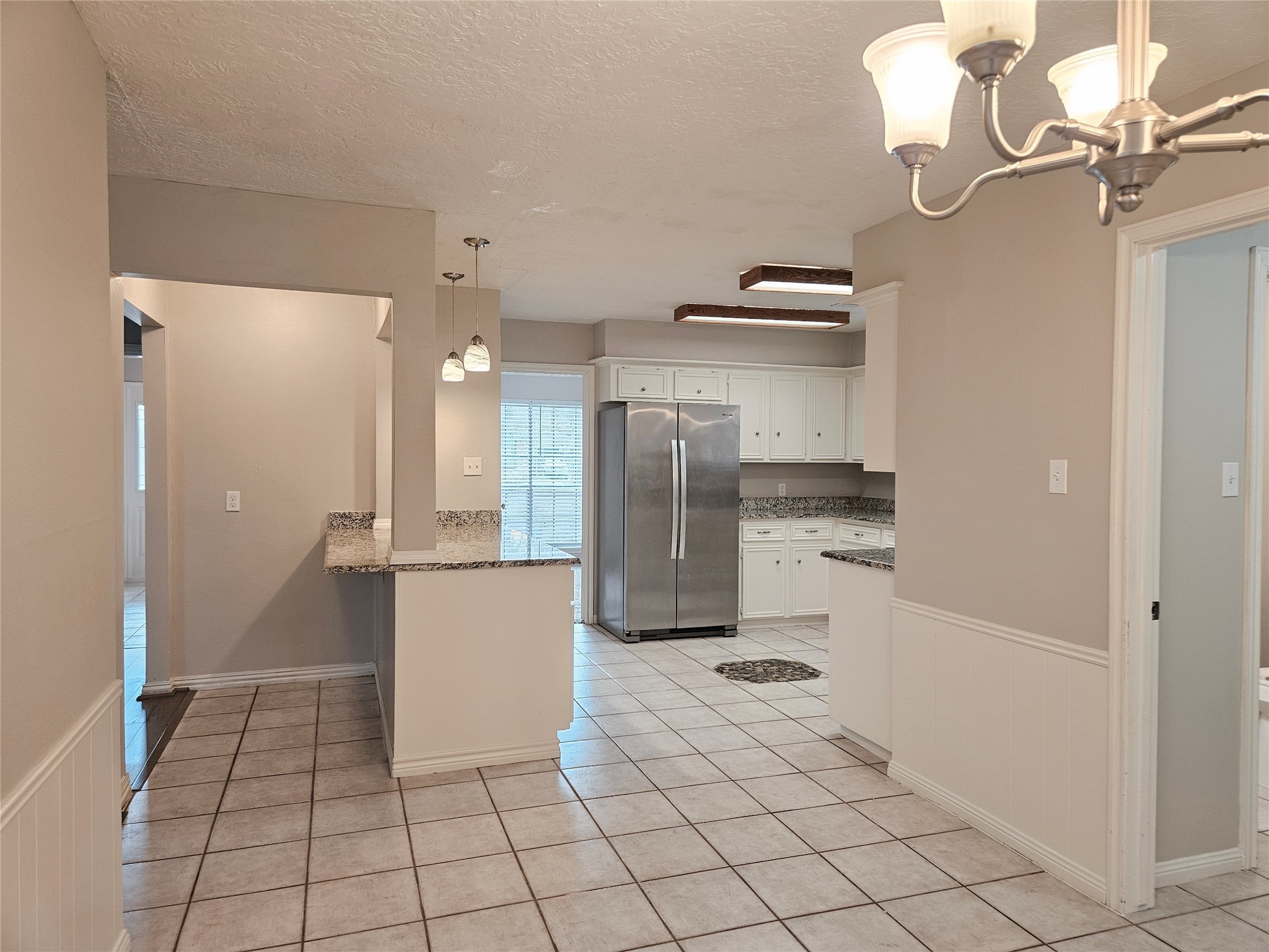 6126 Inway Drive Spring, TX 77389 - Photo 6 of 27 a kitchen with stainless steel appliances kitchen island granite countertop a refrigerator and a sink