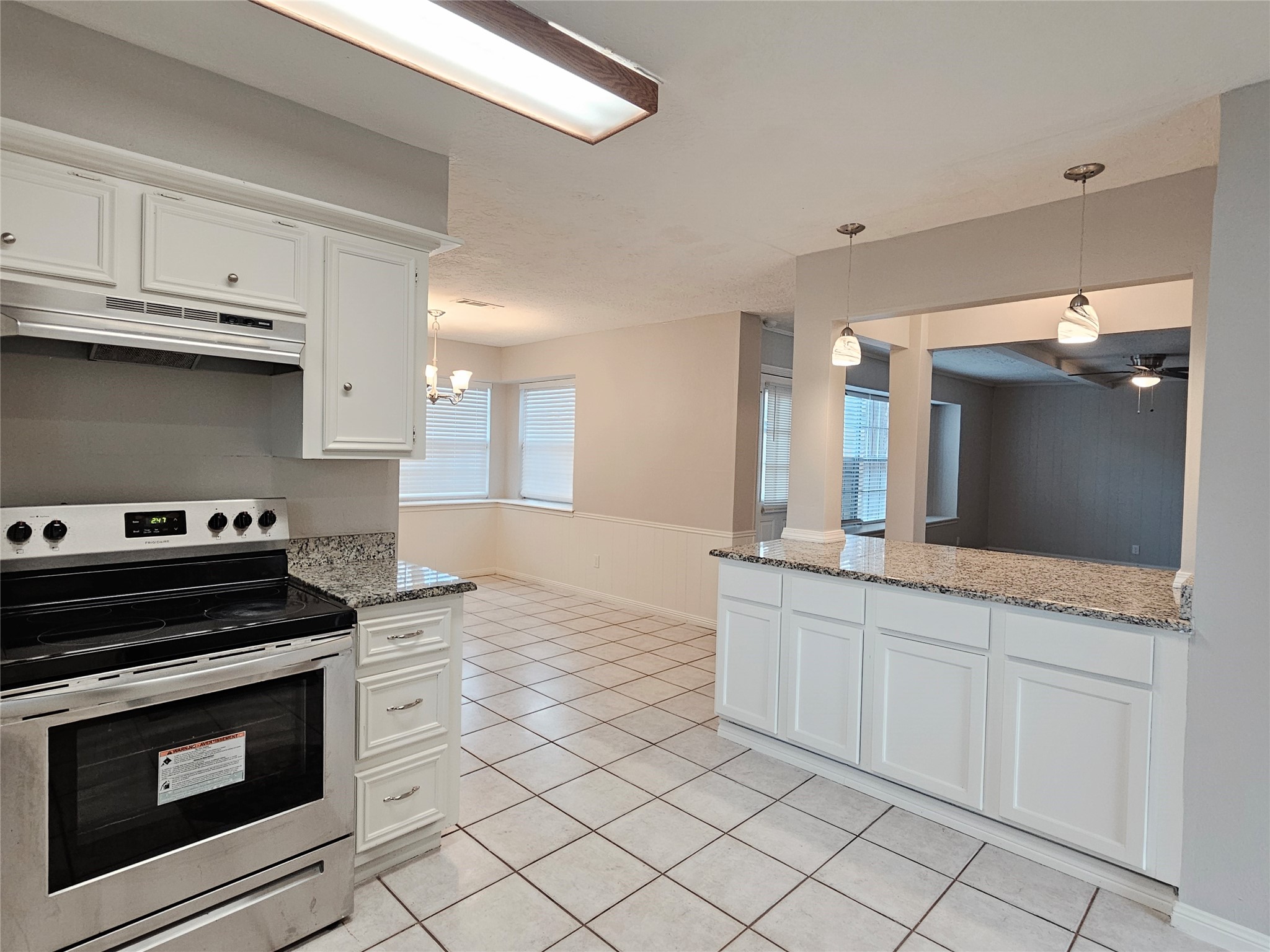 6126 Inway Drive Spring, TX 77389 - Photo 10 of 27 a kitchen with granite countertop a stove sink and cabinets