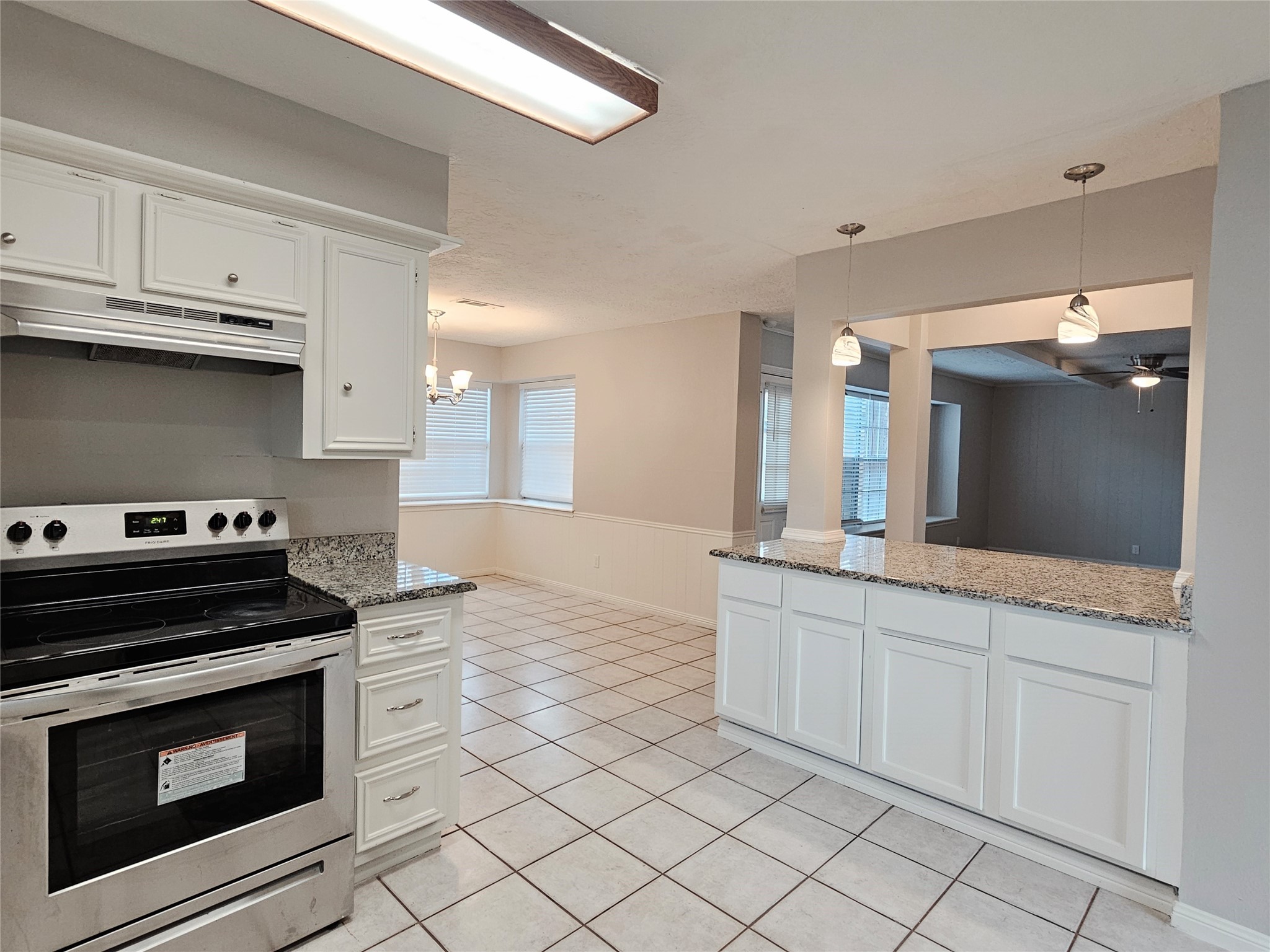 6126 Inway Drive Spring, TX 77389 - Photo 10 of 27 a kitchen with granite countertop a stove sink and cabinets