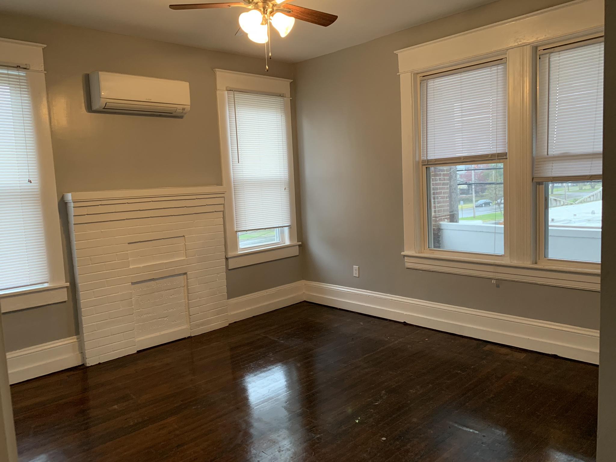 312 13th Street Southwest, Unit 4 (2B) Roanoke, VA 24016 - Photo 4 of 12 a view of an empty room with wooden floor and a window