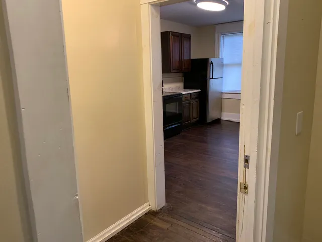 a view of a kitchen from the hallway