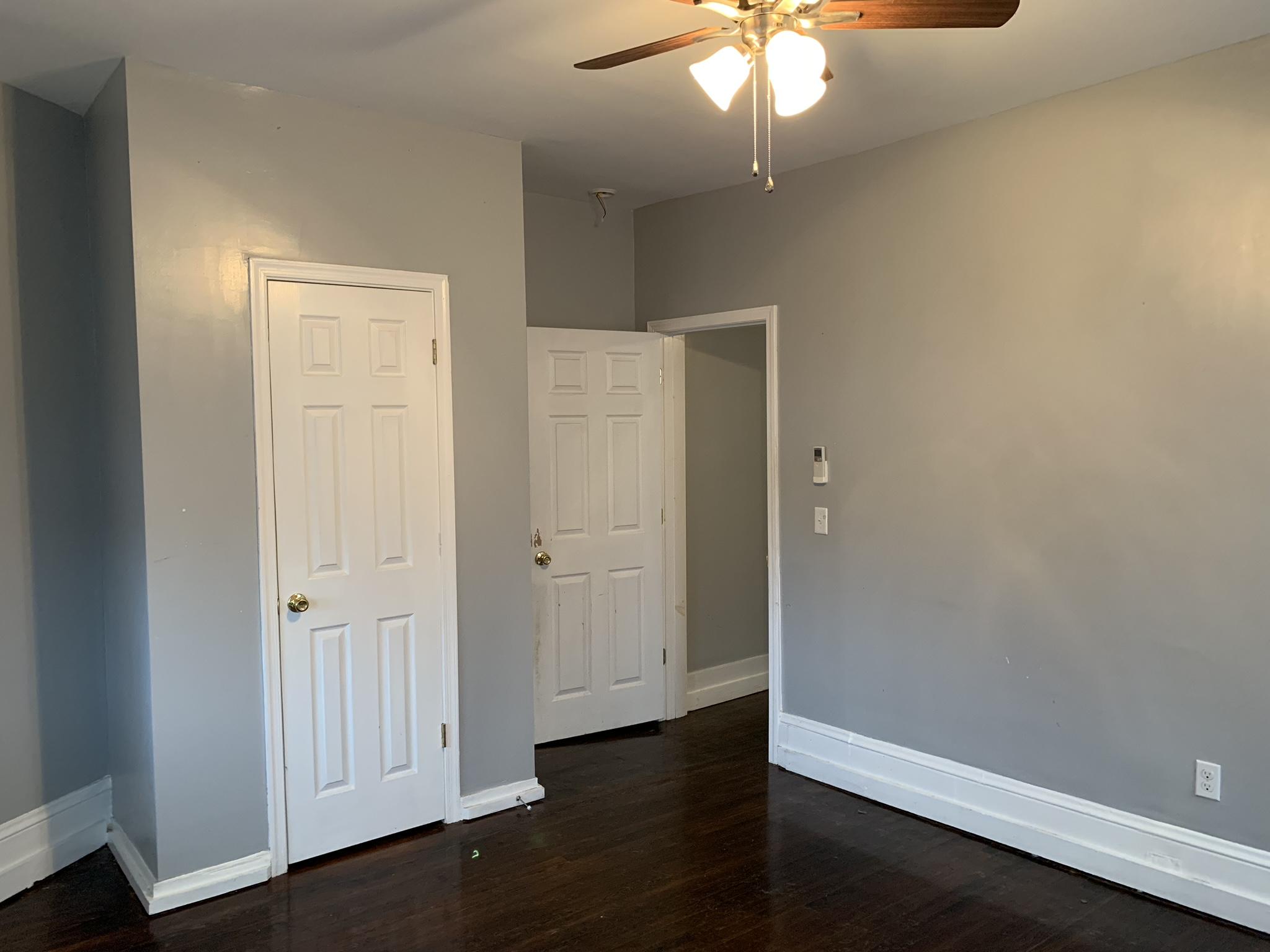 312 13th Street Southwest, Unit 4 (2B) Roanoke, VA 24016 - Photo 8 of 12 an empty room with wooden floor closet and windows