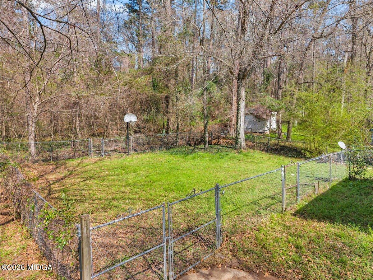 616 Will Scarlet Way Macon, GA 31220 - Photo 3 of 5 a view of yard with swimming pool and green space