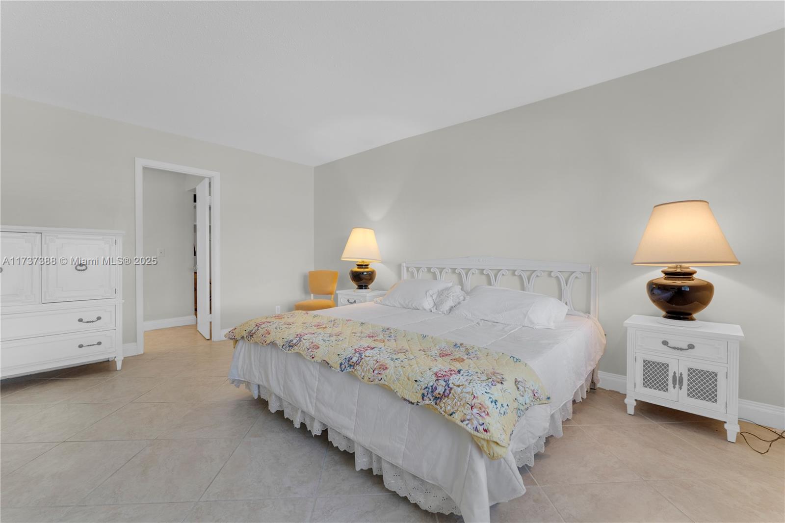 200 Diplomat Parkway, Unit 229 Hallandale Beach, FL 33009 - Photo 19 of 30 a bedroom with a bed and a couch