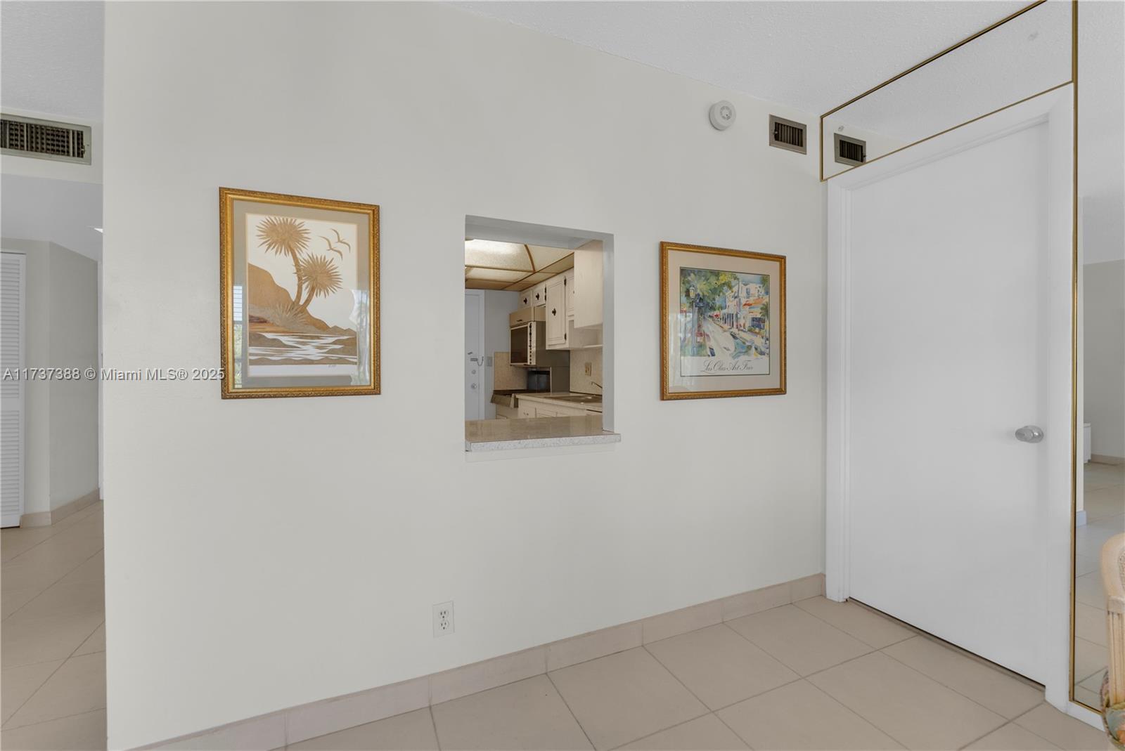 200 Diplomat Parkway, Unit 229 Hallandale Beach, FL 33009 - Photo 20 of 30 a view of a hallway with a elevator