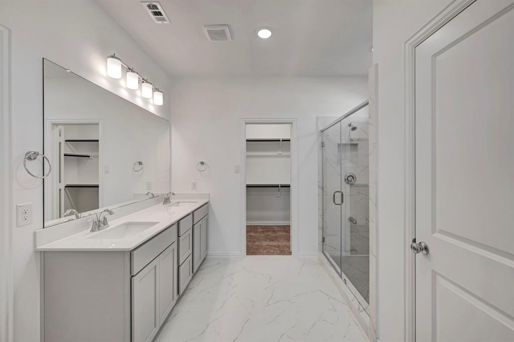 3704 Water Lily Way Prosper, TX 75078 - Photo 21 of 40 a bathroom with a double vanity sink mirror and double