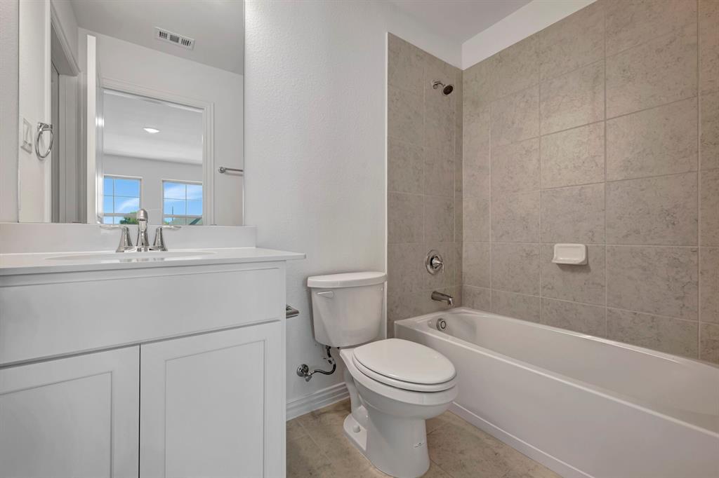 3704 Water Lily Way Prosper, TX 75078 - Photo 27 of 40 a bathroom with a sink a toilet and shower