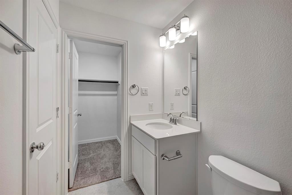3704 Water Lily Way Prosper, TX 75078 - Photo 35 of 40 a bathroom with a sink a toilet and shower