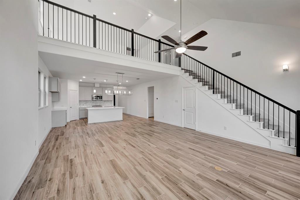 3704 Water Lily Way Prosper, TX 75078 - Photo 4 of 40 a view of staircase and kitchen with sink