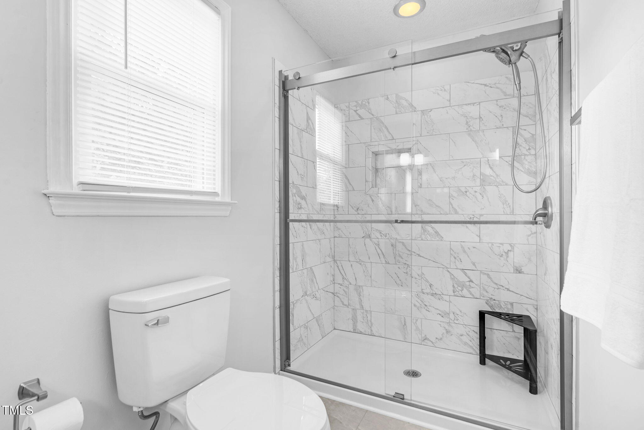 209 Bradley Drive Benson, NC 27504 - Photo 11 of 20 a bathroom with a shower and toilet