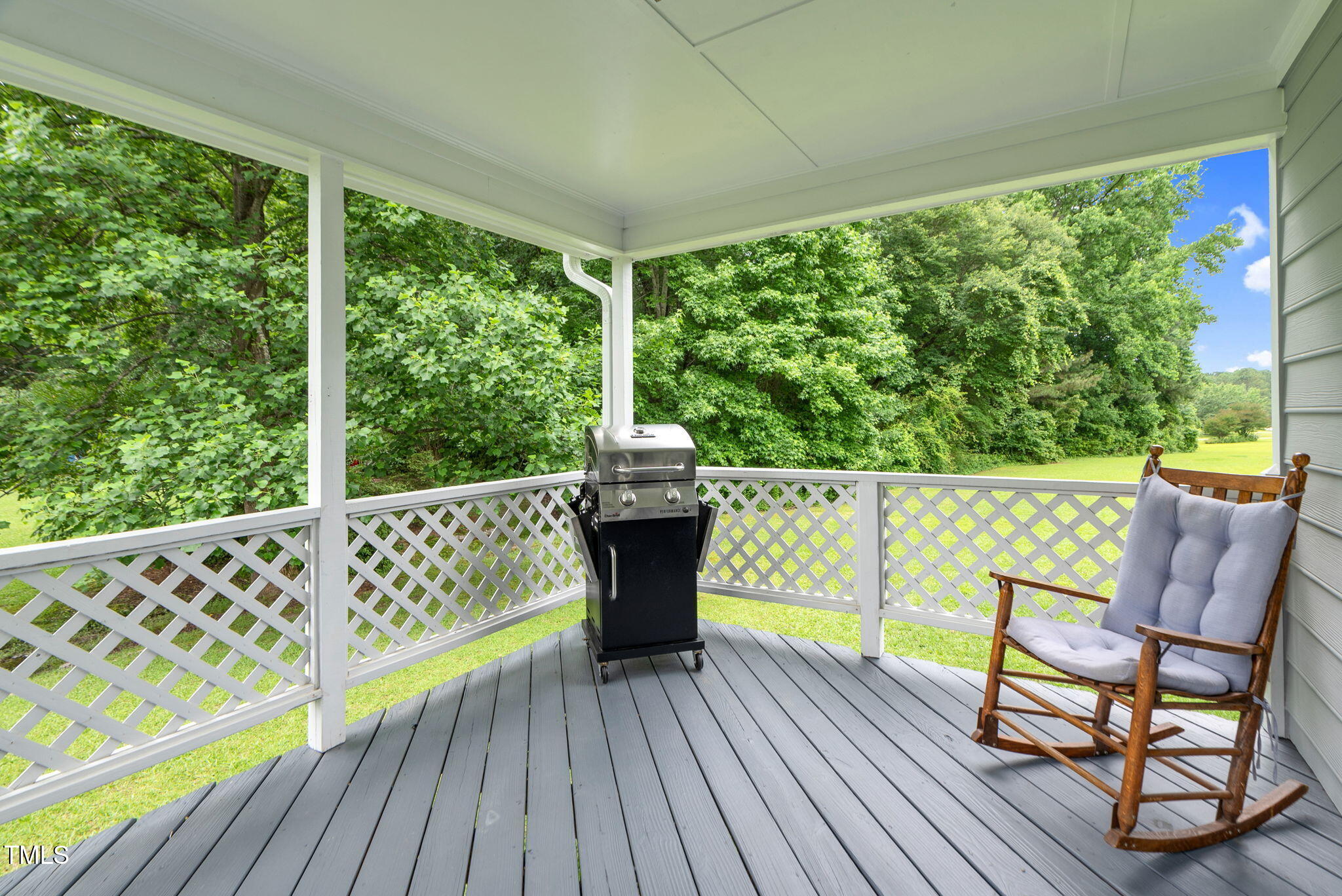 209 Bradley Drive Benson, NC 27504 - Photo 17 of 20 a view of roof deck with wooden floor and outdoor seating