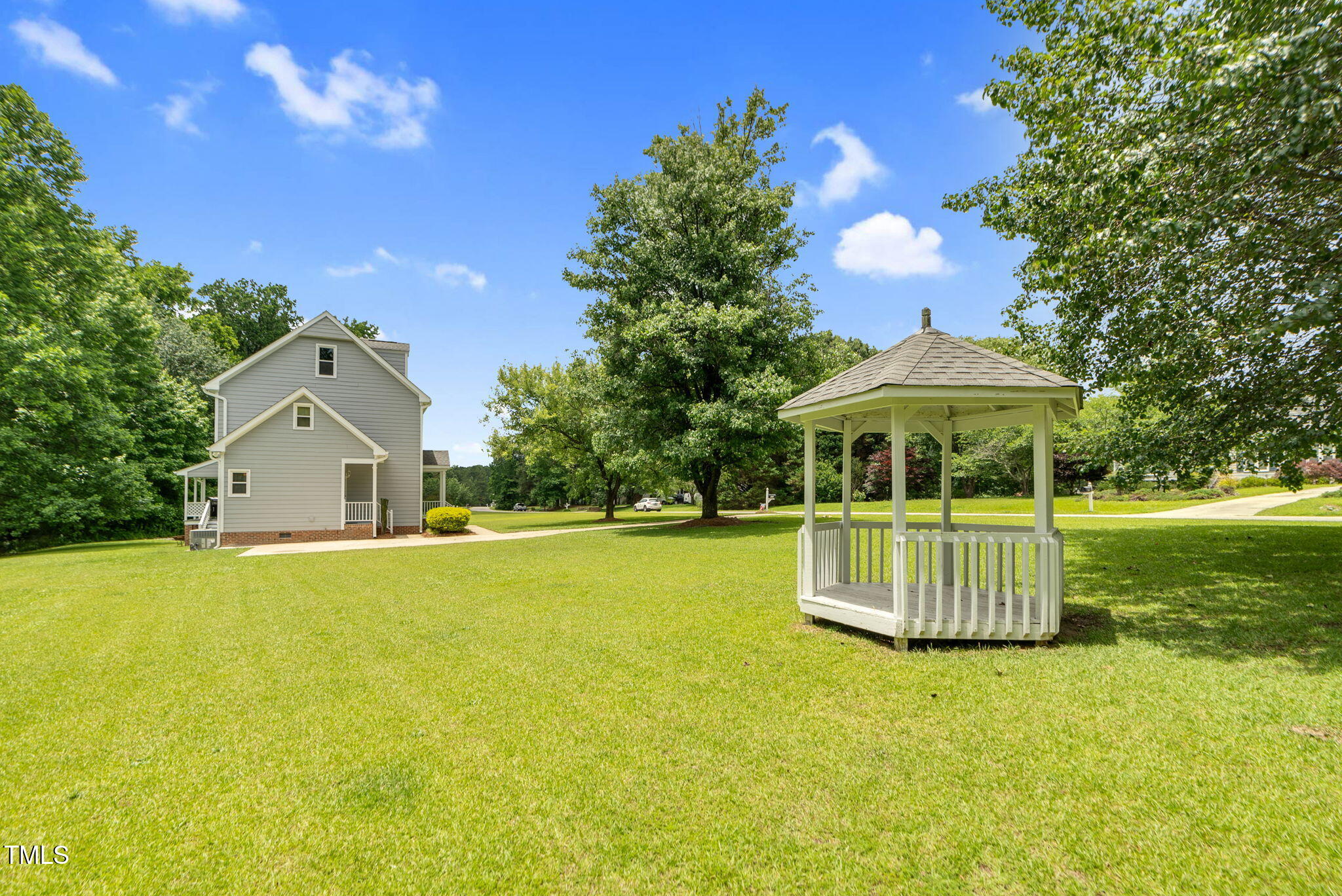 209 Bradley Drive Benson, NC 27504 - Photo 19 of 20 a front view of a house with a garden and yard