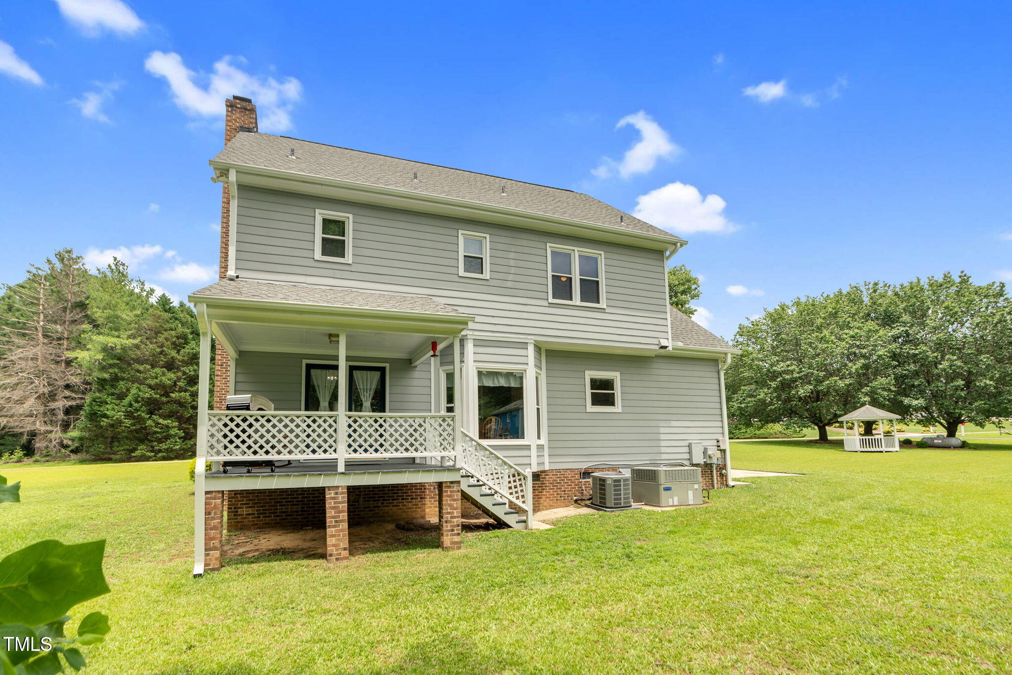 209 Bradley Drive Benson, NC 27504 - Photo 2 of 20 a front view of a house with a yard and garage