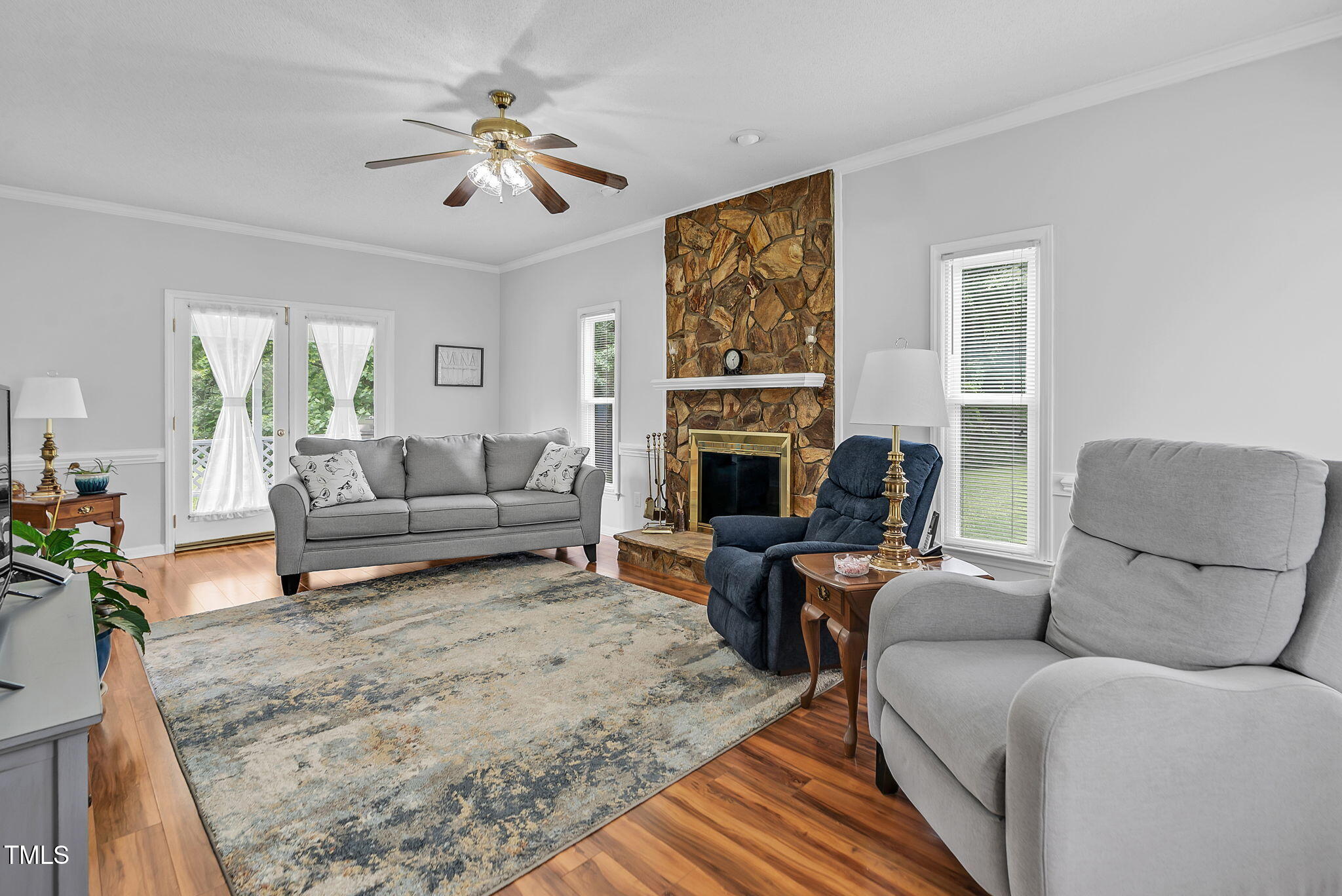 209 Bradley Drive Benson, NC 27504 - Photo 5 of 20 a living room with furniture and a fireplace