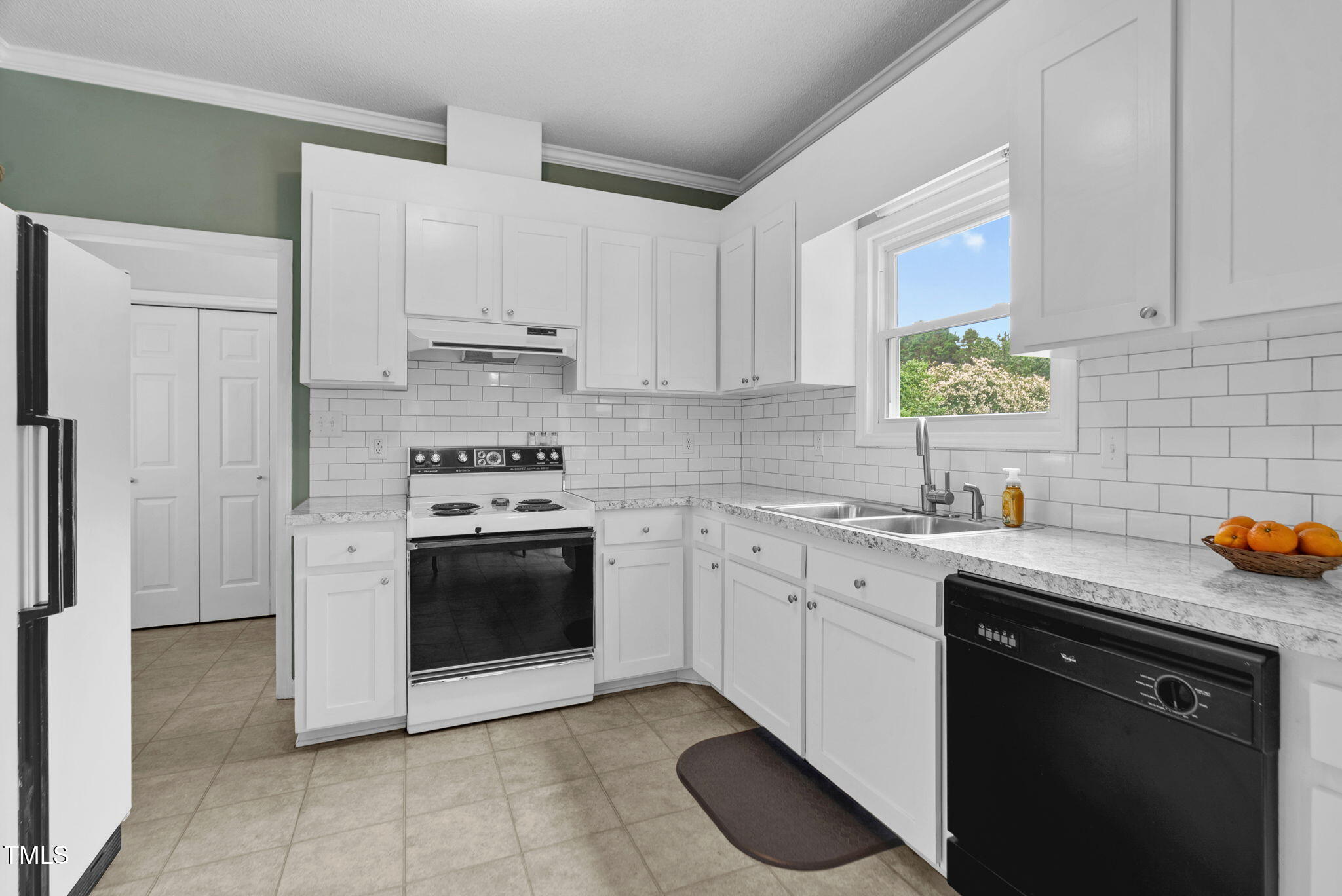 209 Bradley Drive Benson, NC 27504 - Photo 7 of 20 a kitchen with stainless steel appliances granite countertop a sink stove and refrigerator