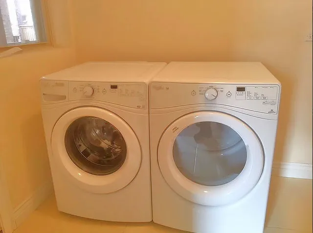 a utility room with dryer and washer