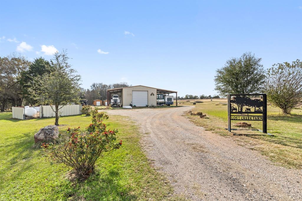 118 Dickey Road Sadler, TX 76264 - Photo 12 of 34 a view of a lake with a yard