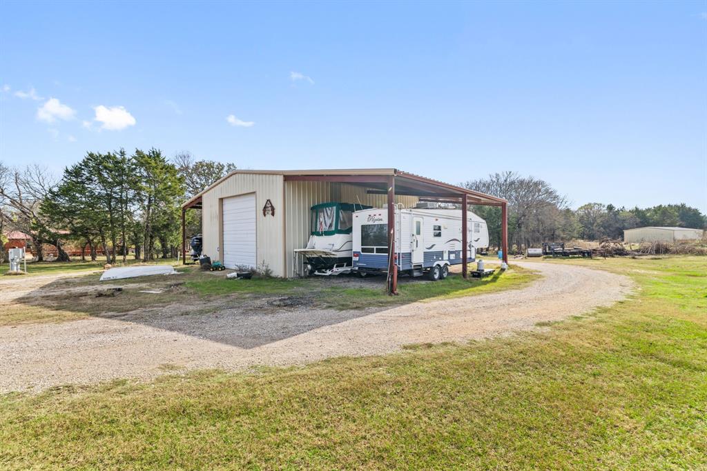 118 Dickey Road Sadler, TX 76264 - Photo 14 of 34 a view of a house with a yard and sitting area