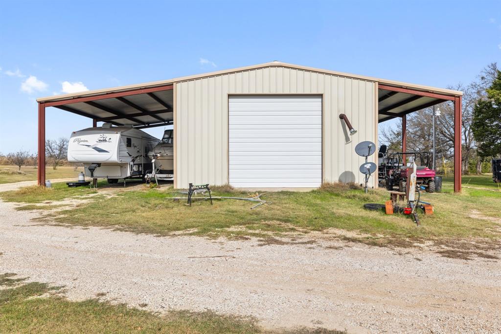 118 Dickey Road Sadler, TX 76264 - Photo 18 of 34 a view of a house with a backyard